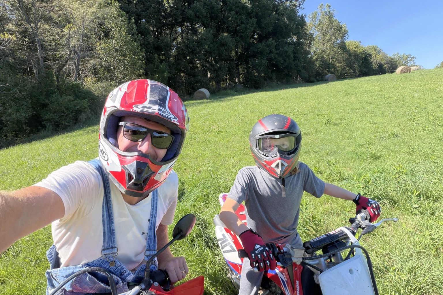 Original photograph of a parent and child with their current dirt bikes, shared by the founders